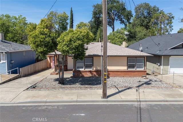 2234 Perkins Ave, Oroville, CA 95966 - view of front of house with brick siding and fence