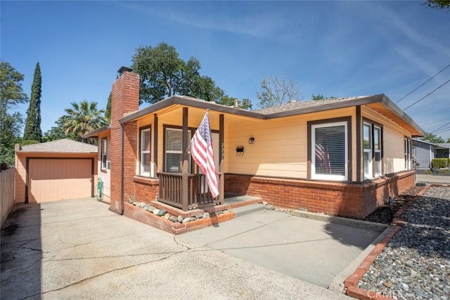 2234 Perkins Ave, Oroville, CA 95966 - ranch-style house featuring brick siding, an outbuilding, a chimney, and a garage