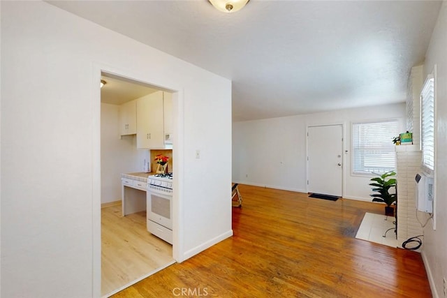 2234 Perkins Ave, Oroville, CA 95966 - foyer with light wood-style floors, baseboards, and a fireplace