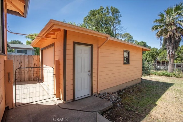 2234 Perkins Ave, Oroville, CA 95966 - view of outdoor structure featuring a gate and an outbuilding