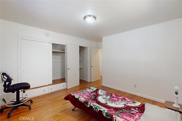 2234 Perkins Ave, Oroville, CA 95966 - bedroom with wood finished floors, a closet, and baseboards