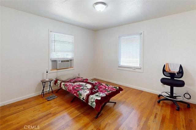 2234 Perkins Ave, Oroville, CA 95966 - bedroom with multiple windows, wood finished floors, and baseboards
