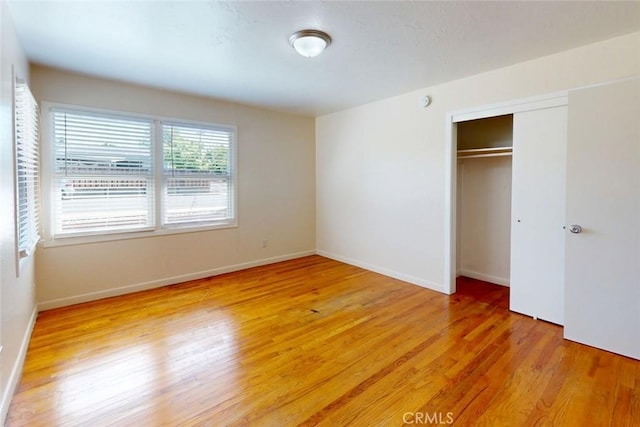 2234 Perkins Ave, Oroville, CA 95966 - unfurnished bedroom with light wood-style floors, a closet, and baseboards