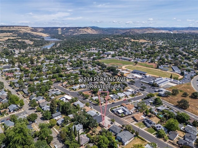 2234 Perkins Ave, Oroville, CA 95966 - aerial view of property and surrounding area with mountains and nearby suburban area