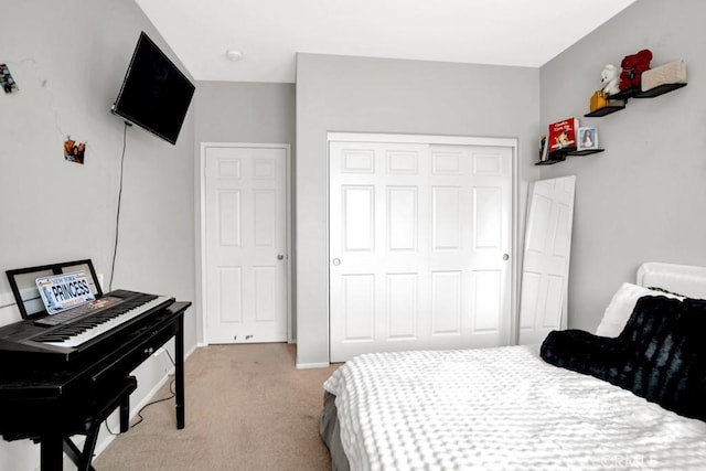 1440 Patricia Ave Unit 102, Simi Valley, CA 93065 - bedroom featuring light carpet, a closet, and baseboards