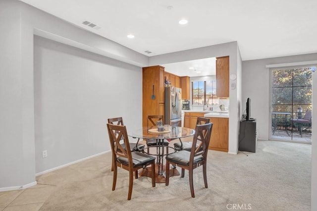 1440 Patricia Ave Unit 102, Simi Valley, CA 93065 - dining area with light colored carpet, recessed lighting, and baseboards