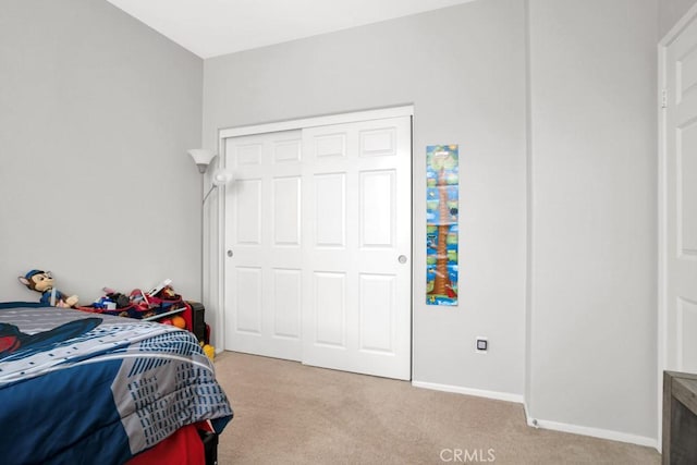 1440 Patricia Ave Unit 102, Simi Valley, CA 93065 - bedroom featuring light colored carpet, baseboards, and a closet
