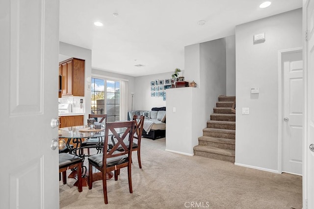 1440 Patricia Ave Unit 102, Simi Valley, CA 93065 - dining area with light carpet, stairway, baseboards, and recessed lighting