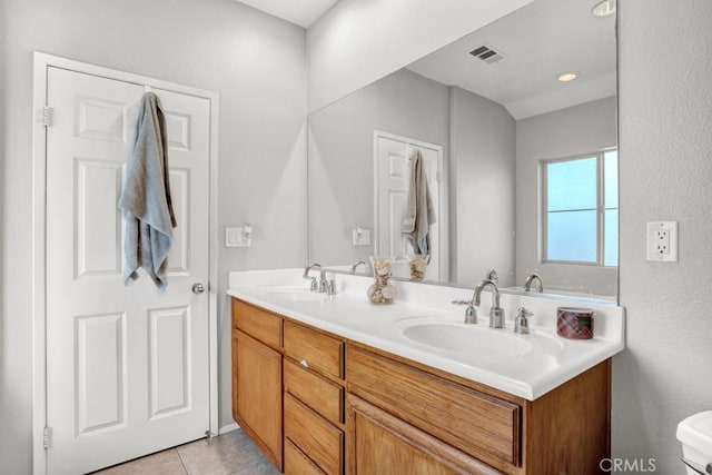 1440 Patricia Ave Unit 102, Simi Valley, CA 93065 - full bathroom with double vanity, tile patterned flooring, and toilet