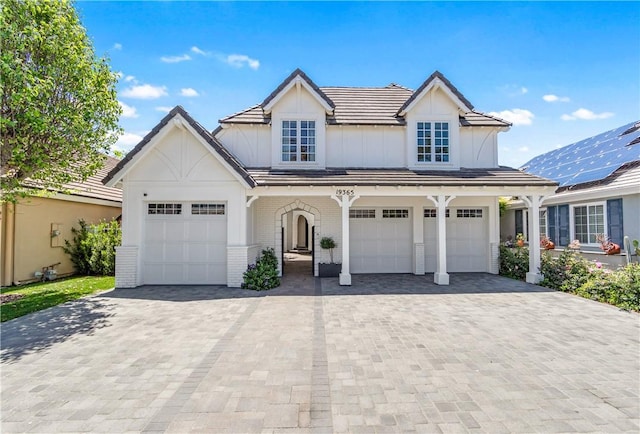 19365 Woodlands Dr, Huntington Beach, CA 92648 - view of front of house featuring decorative driveway and brick siding