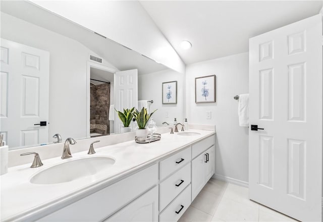 19365 Woodlands Dr, Huntington Beach, CA 92648 - full bath with tile patterned flooring, double vanity, and baseboards