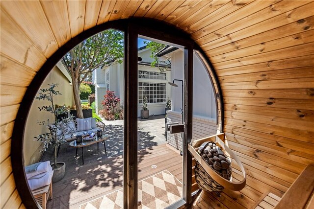 19365 Woodlands Dr, Huntington Beach, CA 92648 - entryway featuring wooden ceiling, vaulted ceiling, and wooden walls