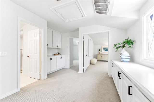 19365 Woodlands Dr, Huntington Beach, CA 92648 - bedroom featuring light colored carpet, lofted ceiling, baseboards, connected bathroom, and attic access