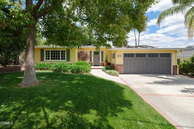 single story home featuring an attached garage, brick siding, concrete driveway, and a front yard