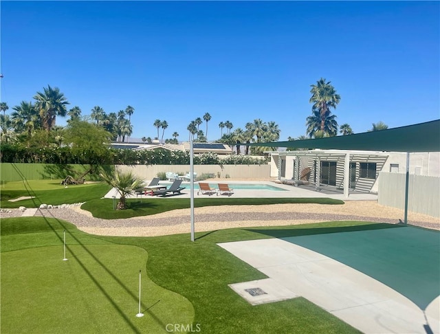 73180 Shadow Mountain Dr, Palm Desert, CA 92260 - view of home's community with a putting green, a patio area, a swimming pool, and a fenced backyard