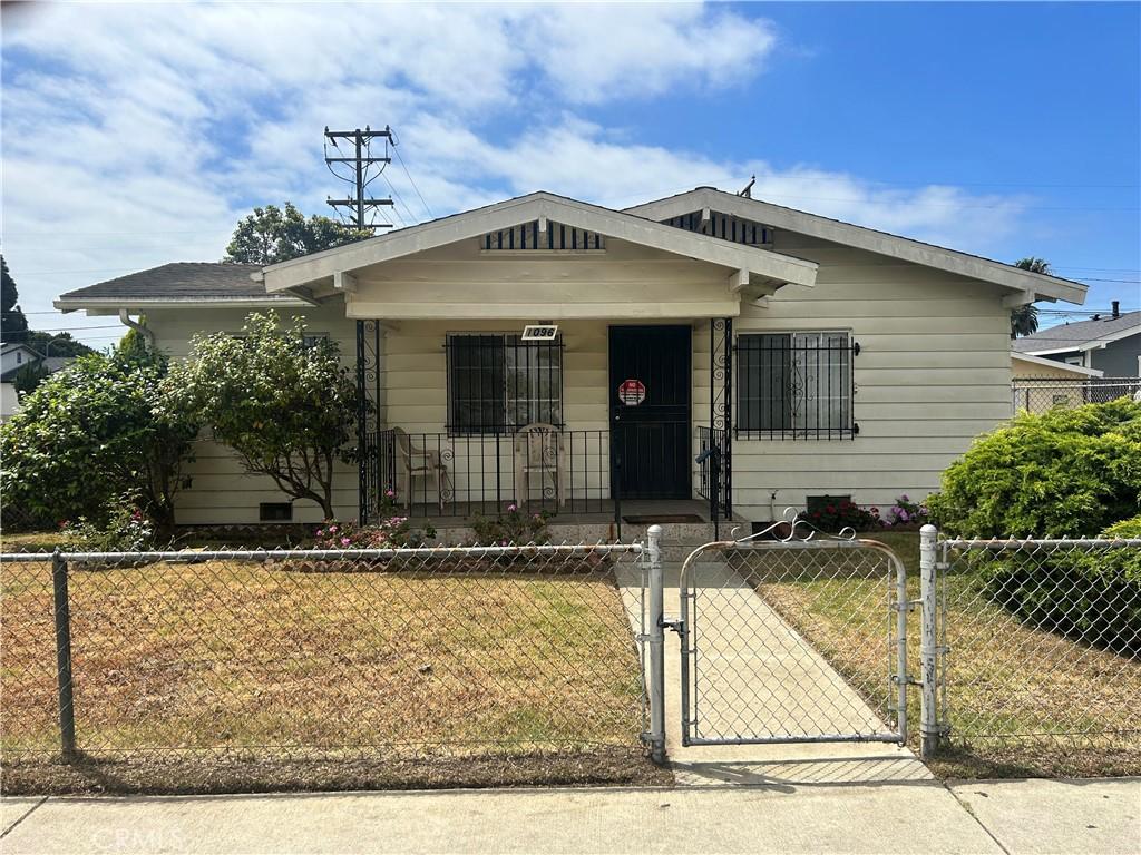 1096 E 20th St, Long Beach, CA 90806 - bungalow-style home featuring a gate and covered porch