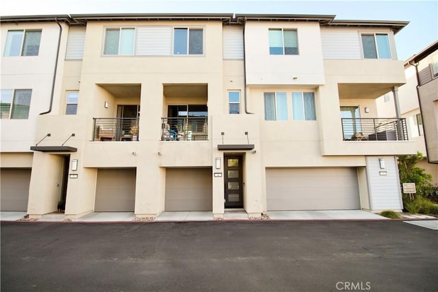 1567 Lima Way Unit 4, Placentia, CA 92870 - view of front of property with stucco siding and an attached garage