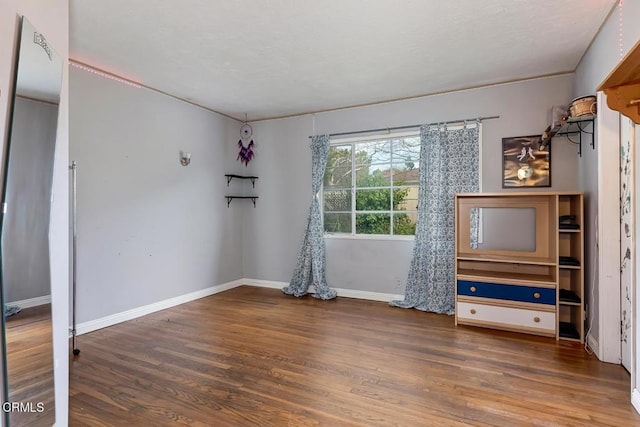 1065 Nithsdale Rd, Pasadena, CA 91105 - empty room with wood finished floors and baseboards