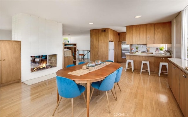 1737 Via Boronada, Palos Verdes Estates, CA 90274 - dining room with light wood finished floors, a multi sided fireplace, and recessed lighting