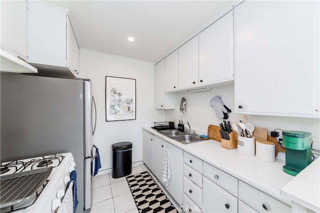 1850 W Greenleaf Ave Unit G, Anaheim, CA 92801 - kitchen featuring a sink, white gas stove, white cabinetry, light countertops, and freestanding refrigerator