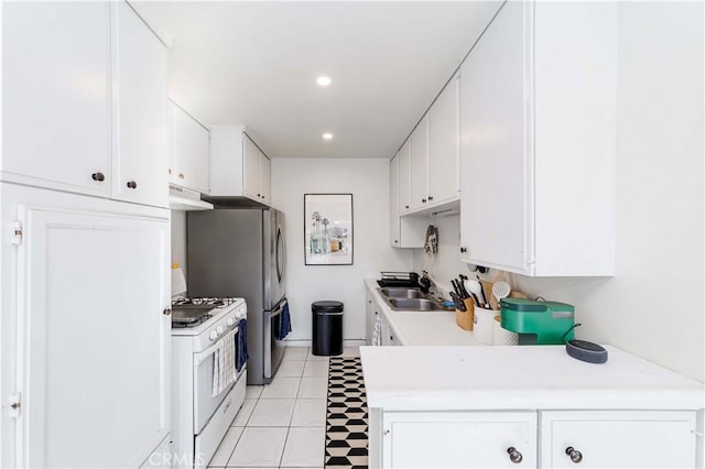 1850 W Greenleaf Ave Unit G, Anaheim, CA 92801 - kitchen featuring white range with gas stovetop, a sink, under cabinet range hood, white cabinets, and recessed lighting