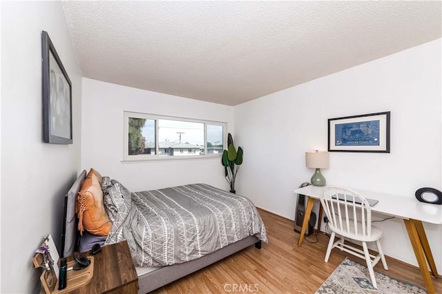 1850 W Greenleaf Ave Unit G, Anaheim, CA 92801 - bedroom with wood finished floors and a textured ceiling