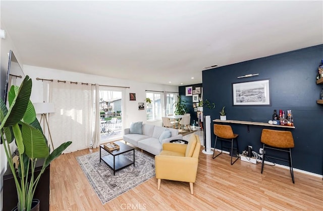 1850 W Greenleaf Ave Unit G, Anaheim, CA 92801 - living room with wood finished floors and a bar