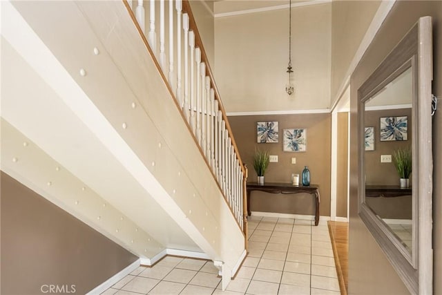 5642 Burlingame Ave, Buena Park, CA 90621 - staircase featuring tile patterned flooring, baseboards, and a high ceiling