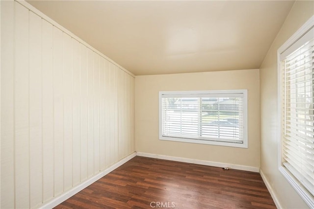 5642 Burlingame Ave, Buena Park, CA 90621 - spare room featuring dark wood-style flooring and baseboards