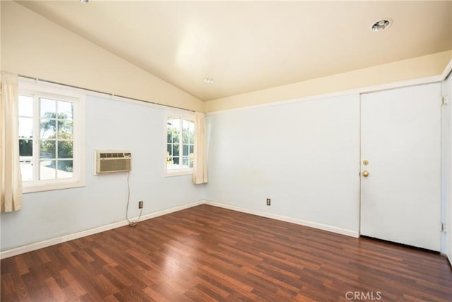 5642 Burlingame Ave, Buena Park, CA 90621 - empty room featuring lofted ceiling, wood finished floors, healthy amount of natural light, a wall unit AC, and baseboards