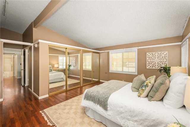 5642 Burlingame Ave, Buena Park, CA 90621 - bedroom featuring vaulted ceiling, wood finished floors, a textured ceiling, multiple closets, and baseboards