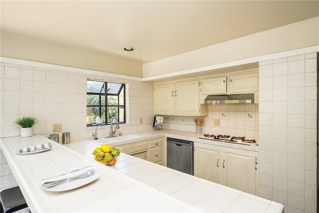 5642 Burlingame Ave, Buena Park, CA 90621 - kitchen featuring stainless steel dishwasher, white gas stovetop, tile countertops, a sink, and backsplash