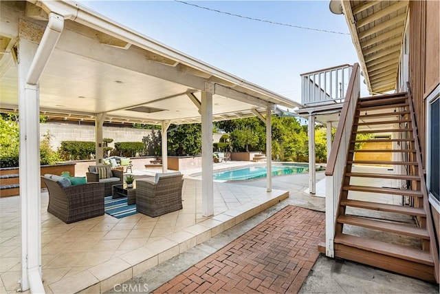 5642 Burlingame Ave, Buena Park, CA 90621 - view of patio with stairs, an outdoor living space, and an outdoor pool