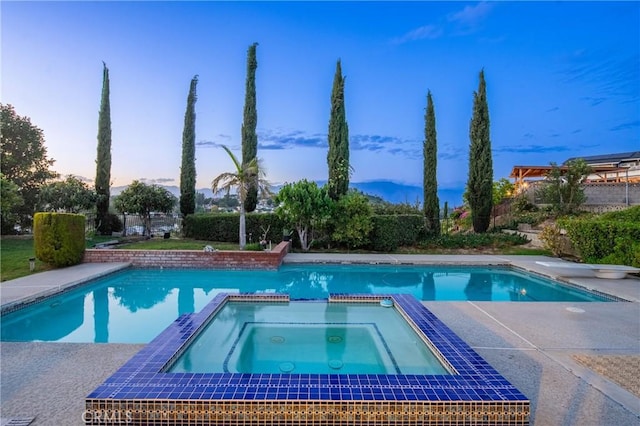 979 Ridgecrest St, Monterey Park, CA 91754 - pool at dusk with a pool with connected hot tub