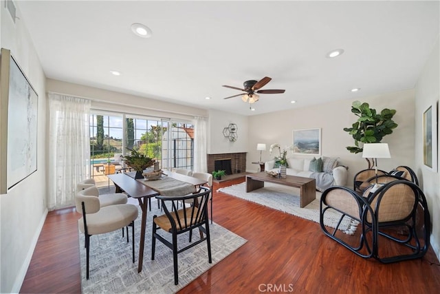 979 Ridgecrest St, Monterey Park, CA 91754 - dining area featuring wood finished floors, a brick fireplace, ceiling fan, baseboards, and recessed lighting
