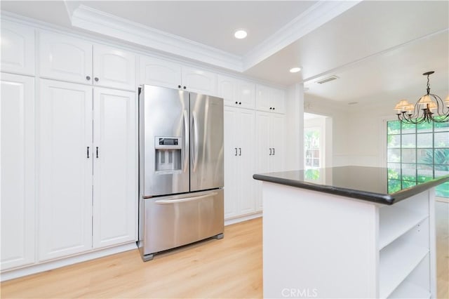 29355 Shell Cv, Laguna Niguel, CA 92677 - kitchen with stainless steel refrigerator with ice dispenser, ornamental molding, dark countertops, white cabinets, and light wood-type flooring