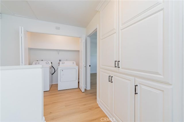 29355 Shell Cv, Laguna Niguel, CA 92677 - clothes washing area with independent washer and dryer and light wood-style flooring