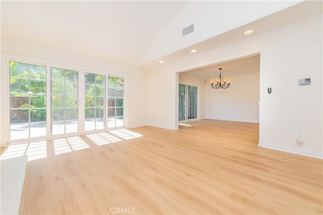 29355 Shell Cv, Laguna Niguel, CA 92677 - spare room featuring a chandelier, light wood finished floors, vaulted ceiling, baseboards, and recessed lighting