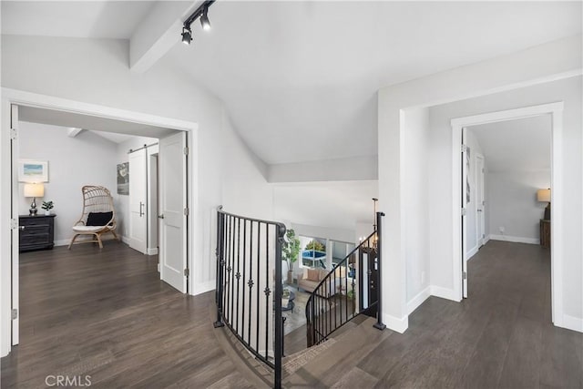 33028 Christina Dr, Dana Point, CA 92629 - hallway featuring an upstairs landing, dark wood-type flooring, and rail lighting