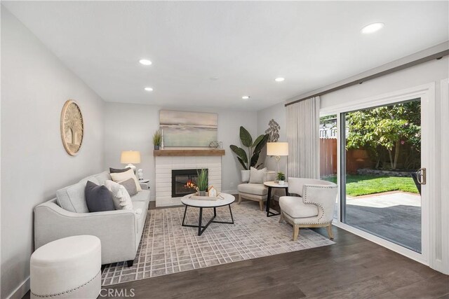 33028 Christina Dr, Dana Point, CA 92629 - living area featuring wood finished floors, recessed lighting, and a lit fireplace