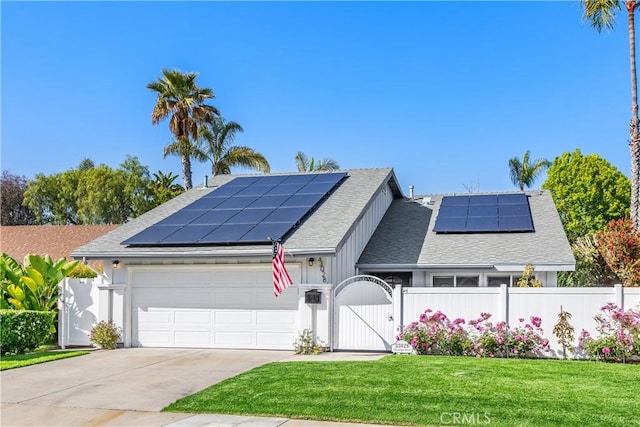 33028 Christina Dr, Dana Point, CA 92629 - view of front facade with a gate, roof mounted solar panels, a garage, and concrete driveway