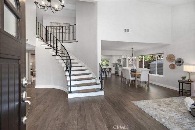 33028 Christina Dr, Dana Point, CA 92629 - entrance foyer with a chandelier, a high ceiling, stairway, and dark wood finished floors