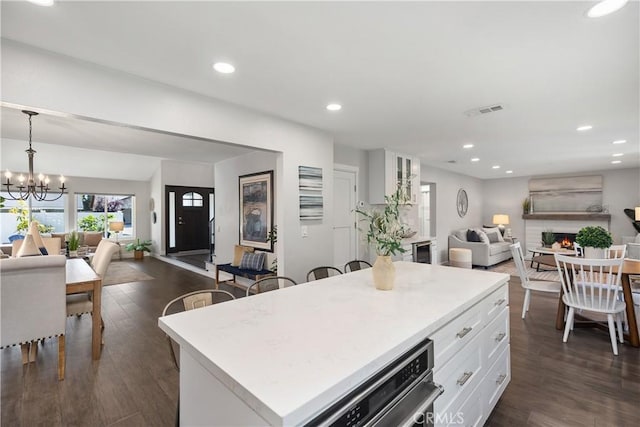 33028 Christina Dr, Dana Point, CA 92629 - kitchen featuring open floor plan, white cabinets, a chandelier, light countertops, and recessed lighting