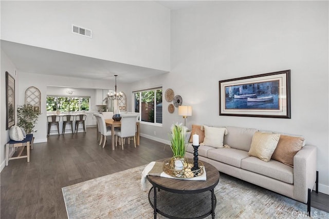 33028 Christina Dr, Dana Point, CA 92629 - living area with dark wood-type flooring, a chandelier, and a high ceiling
