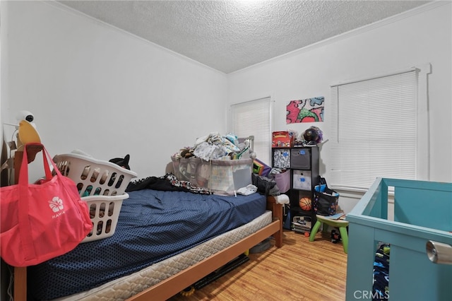 2580 Ganahl St, Los Angeles, CA 90033 - bedroom featuring crown molding, a textured ceiling, and wood finished floors