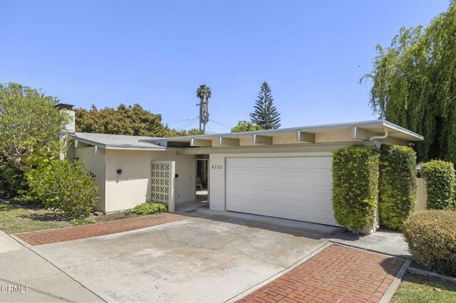 4232 De Paul St, Ventura, CA 93003 - view of front of home featuring a garage, driveway, and stucco siding