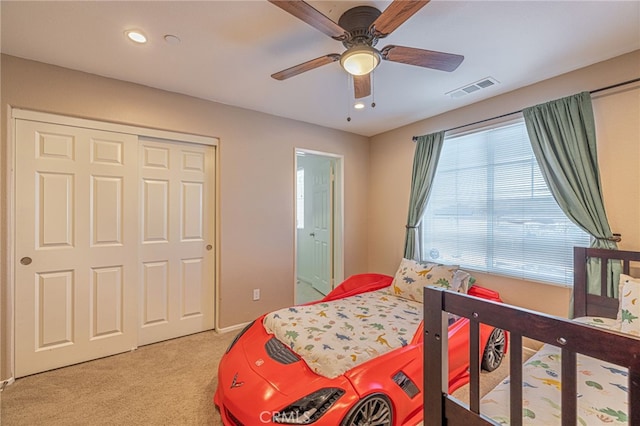 bedroom featuring light colored carpet, recessed lighting, a closet, and ceiling fan
