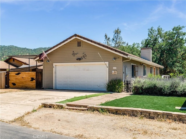 2690 Chaparral Ln, Paso Robles, CA 93446 - ranch-style home with a garage, a chimney, concrete driveway, and a gate