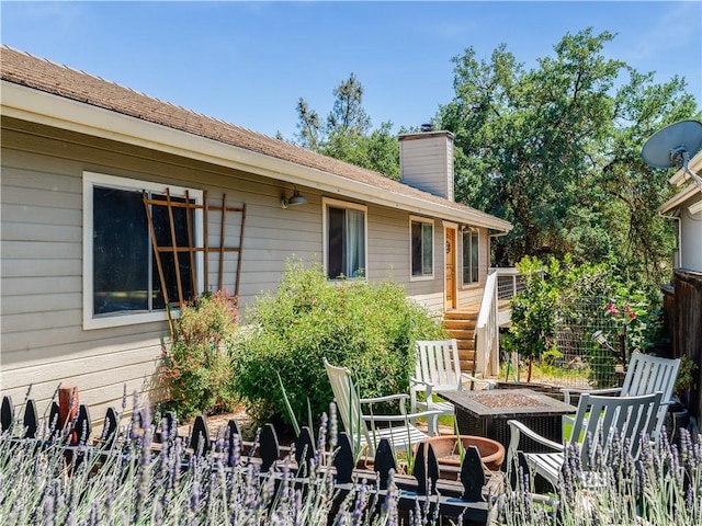 2690 Chaparral Ln, Paso Robles, CA 93446 - back of house featuring an outdoor fire pit, a chimney, and stairway