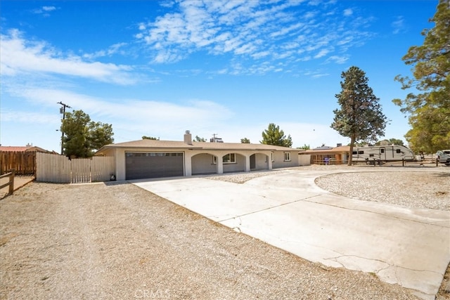 14351 Cronese Rd, Apple Valley, CA 92307 - ranch-style house with a garage, fence, concrete driveway, and stucco siding